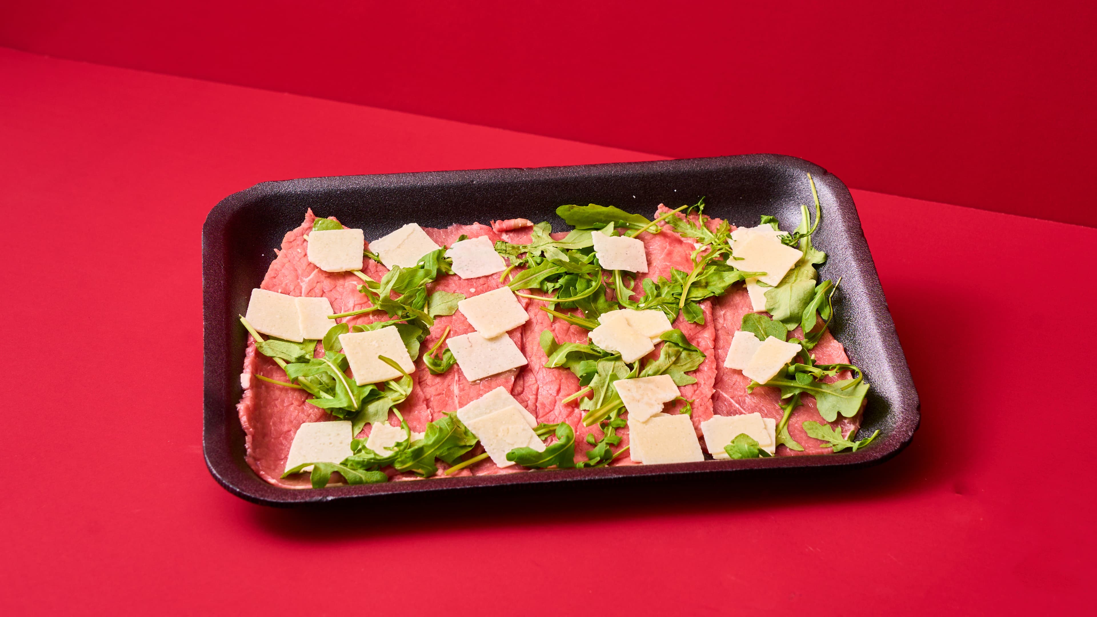 Fettine sottili con rucola e grana